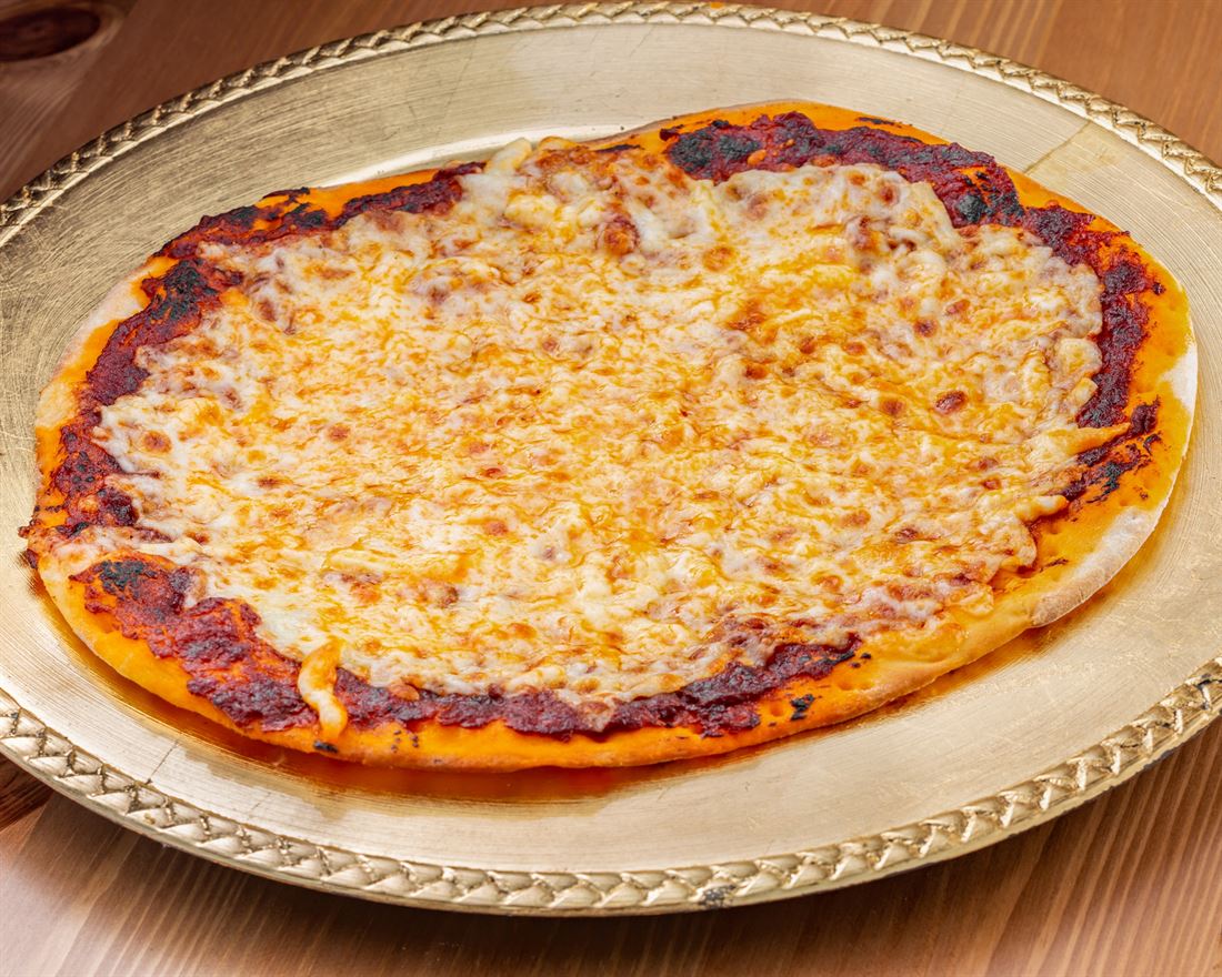 A muhammara and cheese pie on a decorated tray